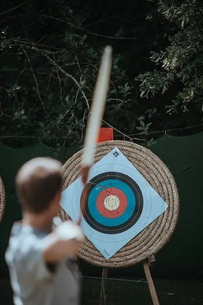 Man with bow aiming